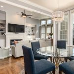 Open living and dining room with chandelier